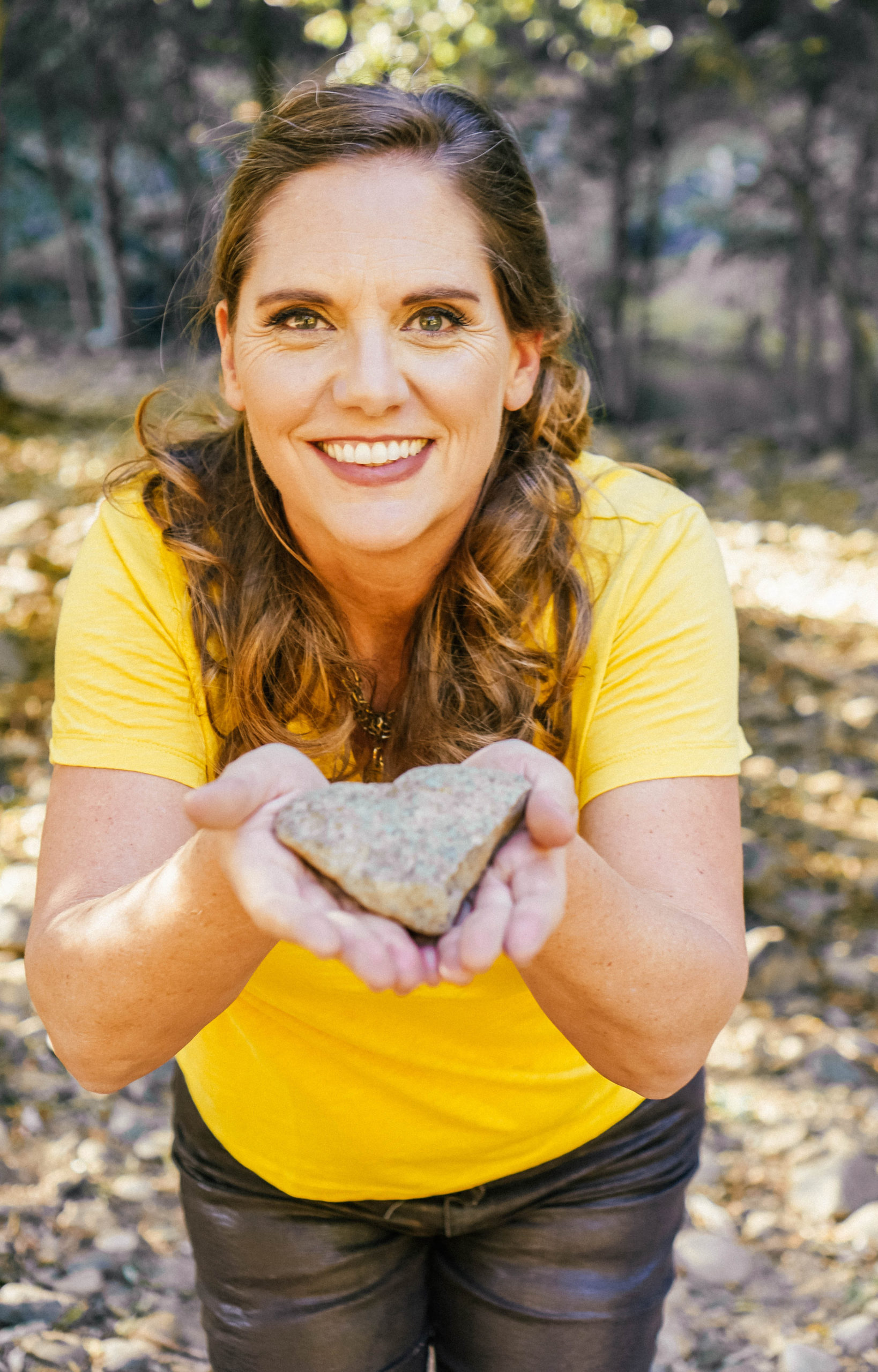 Mellissa holding a heart rock
